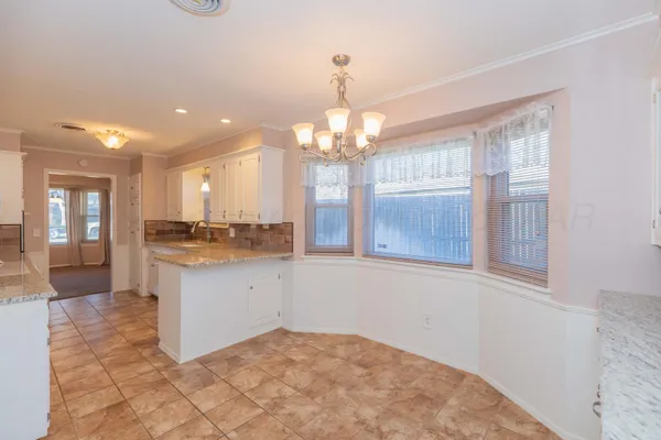 a bathroom with a sink vanity and a mirror