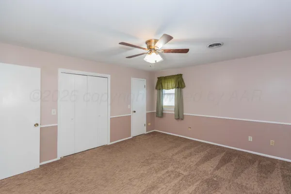 a bathroom with a sink a toilet a mirror and shower