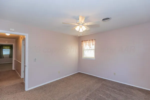 a bathroom with a sink and mirror with toilet