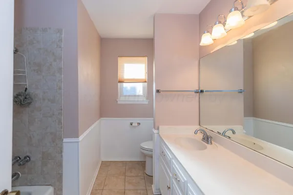 a bathroom with a sink double vanity and a mirror