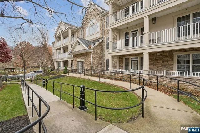 a view of a patio with table and chairs