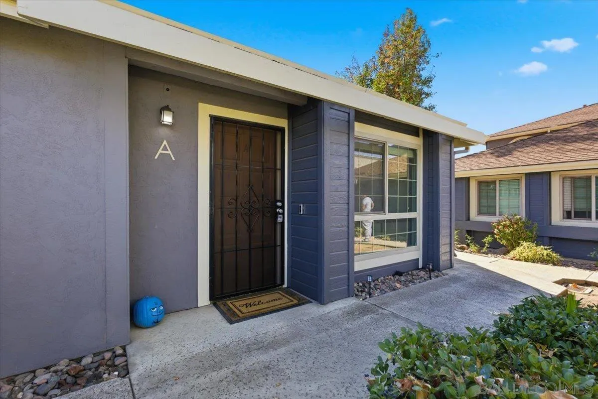 8825 Tamberly Way, Unit A Santee, CA 92071 - Photo 1 of 23 a view of a brick house with potted plants