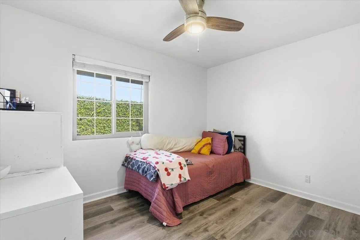 8825 Tamberly Way, Unit A Santee, CA 92071 - Photo 12 of 23 a bedroom with a bed and a window