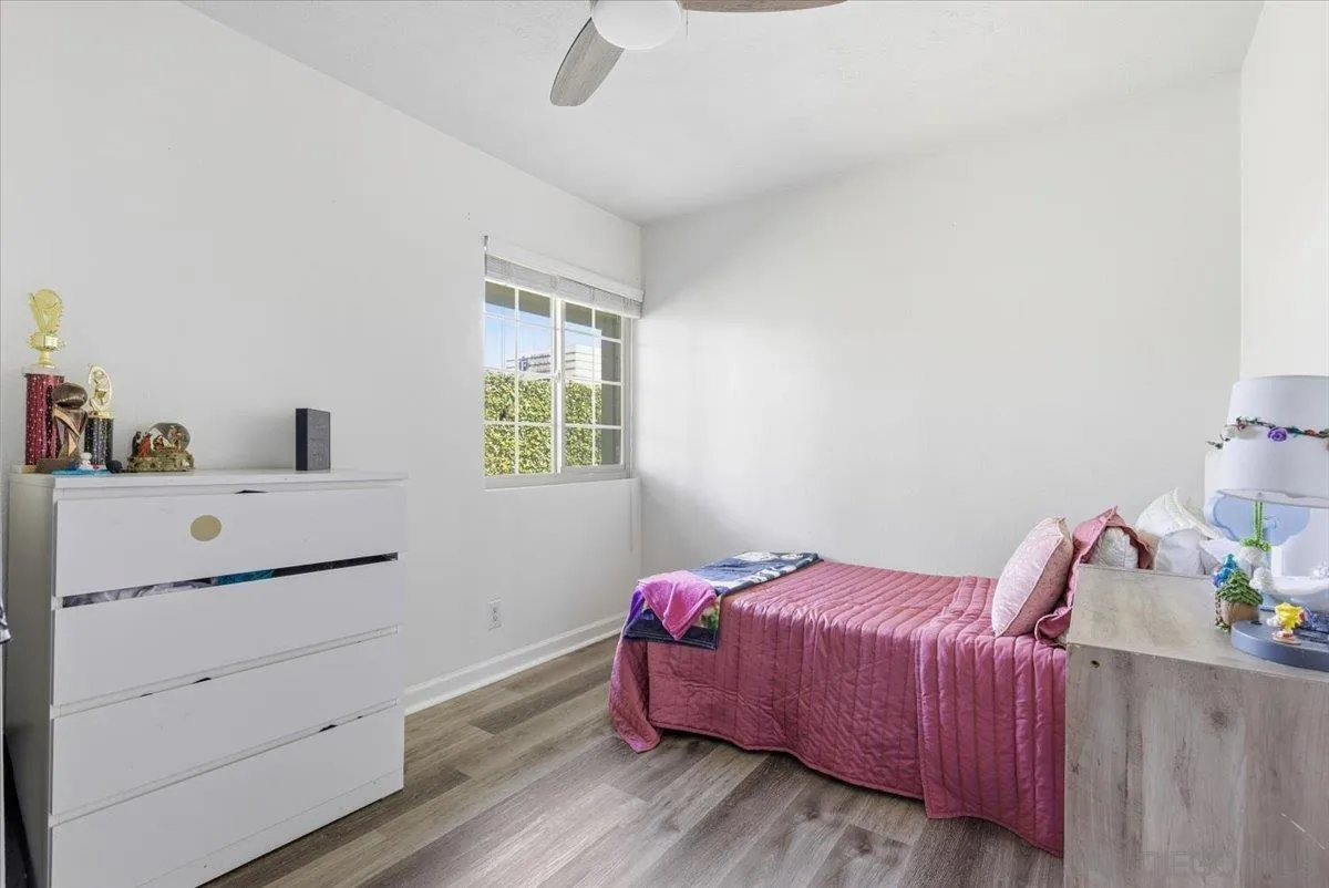 8825 Tamberly Way, Unit A Santee, CA 92071 - Photo 13 of 23 a bedroom with a bed and a dresser