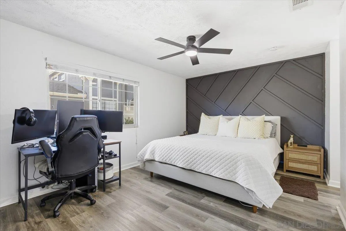 8825 Tamberly Way, Unit A Santee, CA 92071 - Photo 15 of 23 a bedroom with a bed and a desk