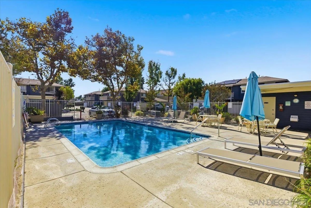 8825 Tamberly Way, Unit A Santee, CA 92071 - Photo 21 of 23 a swimming pool with outdoor seating and yard