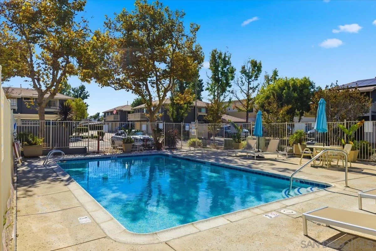 8825 Tamberly Way, Unit A Santee, CA 92071 - Photo 22 of 23 a view of a swimming pool with a lounge chairs