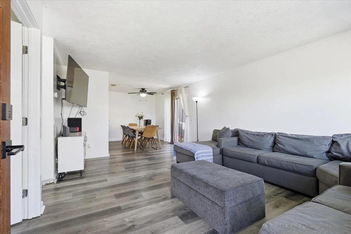 8825 Tamberly Way, Unit A Santee, CA 92071 - Photo 3 of 23 a living room with furniture and a table