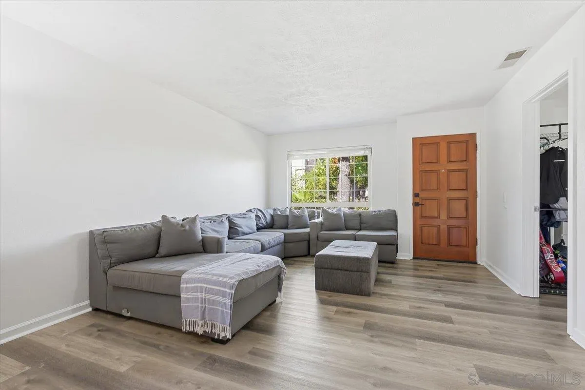 8825 Tamberly Way, Unit A Santee, CA 92071 - Photo 4 of 23 a living room with furniture and a window
