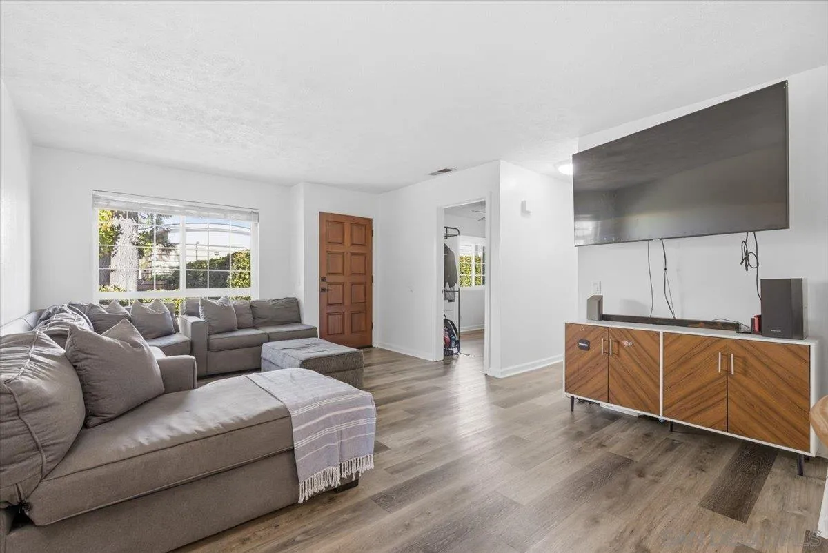8825 Tamberly Way, Unit A Santee, CA 92071 - Photo 5 of 23 a living room with furniture and a flat screen tv