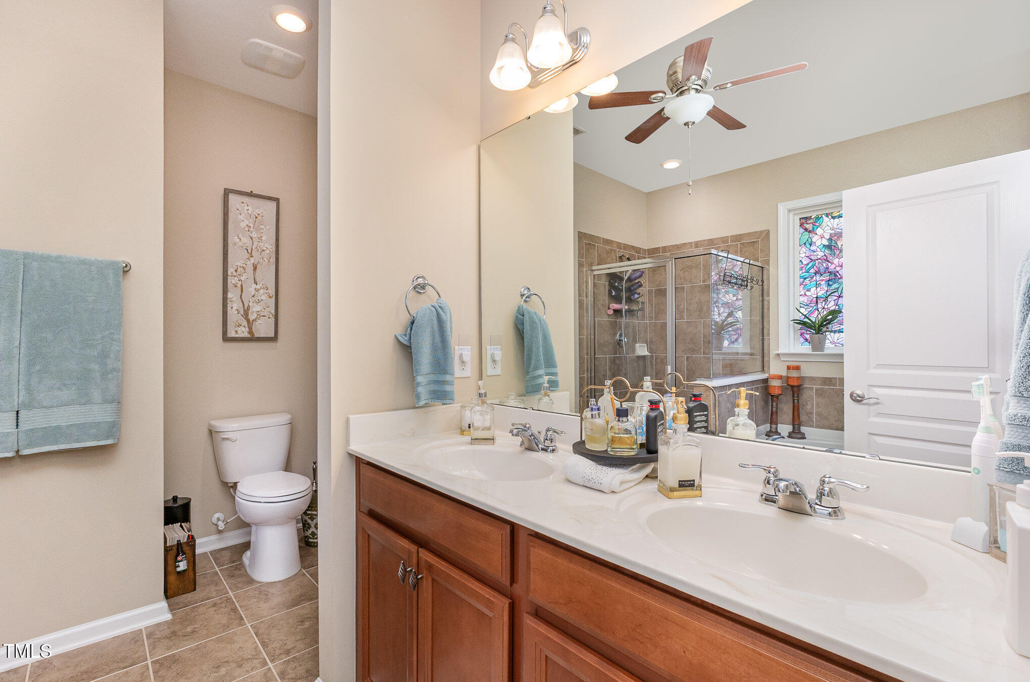 1205 Barnford Mill Road Wake Forest, NC 27587 - Photo 11 of 17 a bathroom with a double vanity sink mirror and toilet
