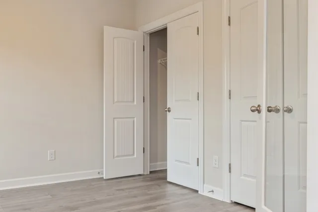 an empty room with wooden floor