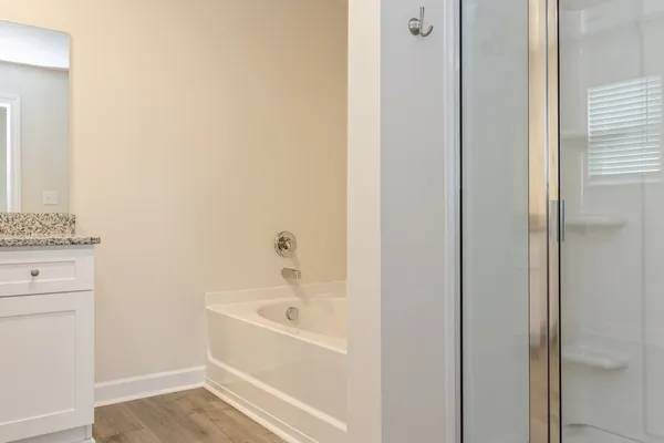 a white bath tub sitting next to a white sink