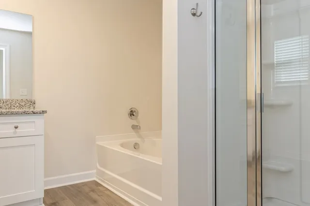 a white bath tub sitting next to a white sink