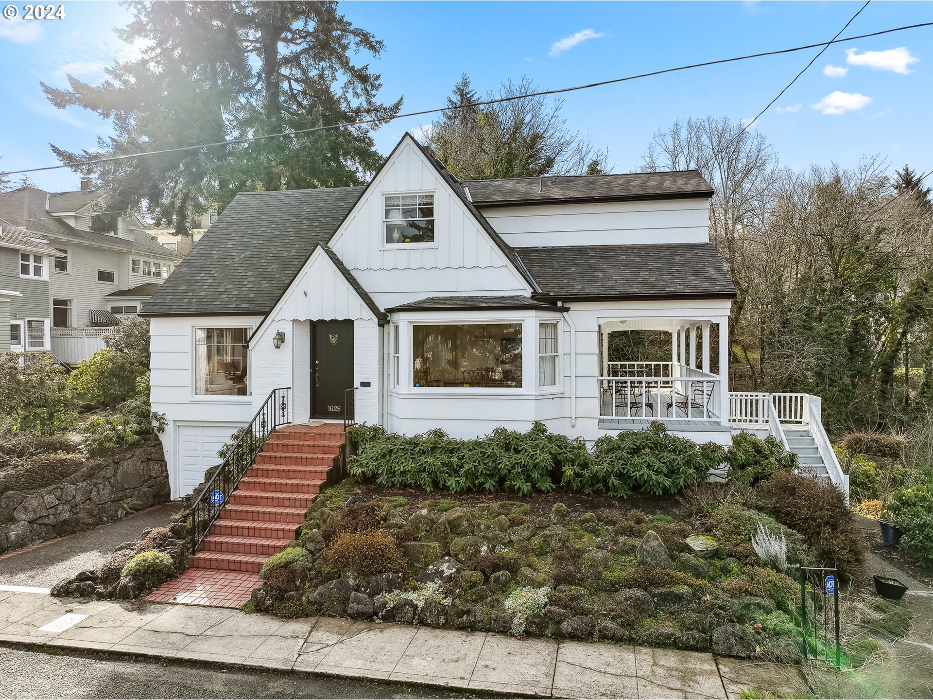 a front view of a house with garden