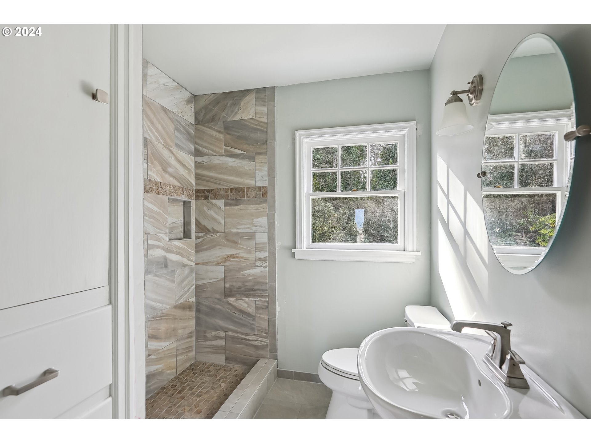 1628 Southwest College Street Portland, OR 97201 - Photo 13 of 25 a bathroom with a sink a toilet and shower