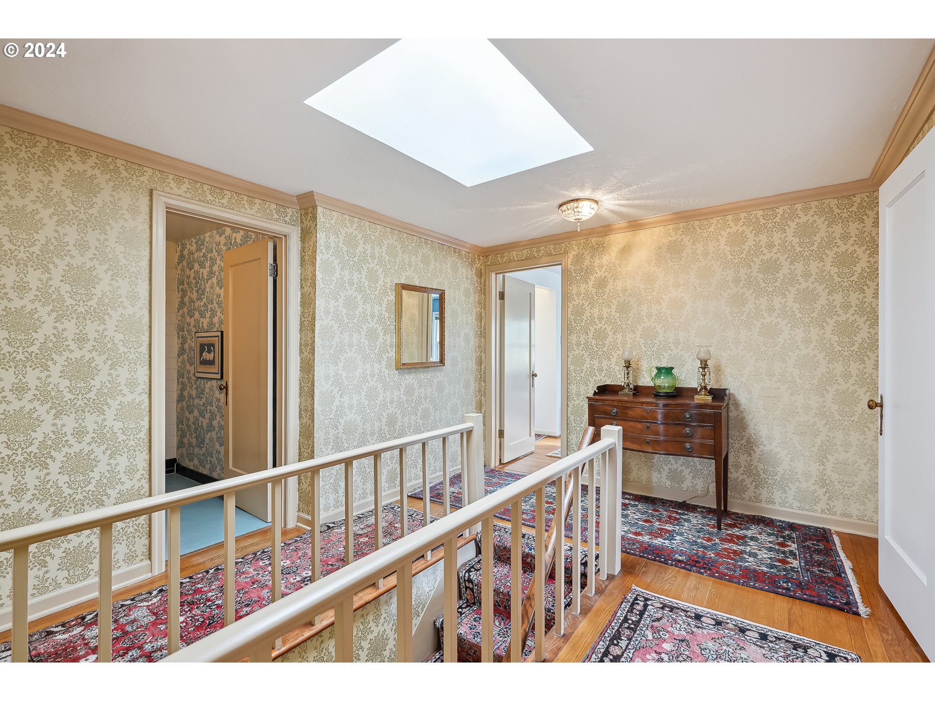1628 Southwest College Street Portland, OR 97201 - Photo 14 of 25 a view of a hallway with wooden floor and windows
