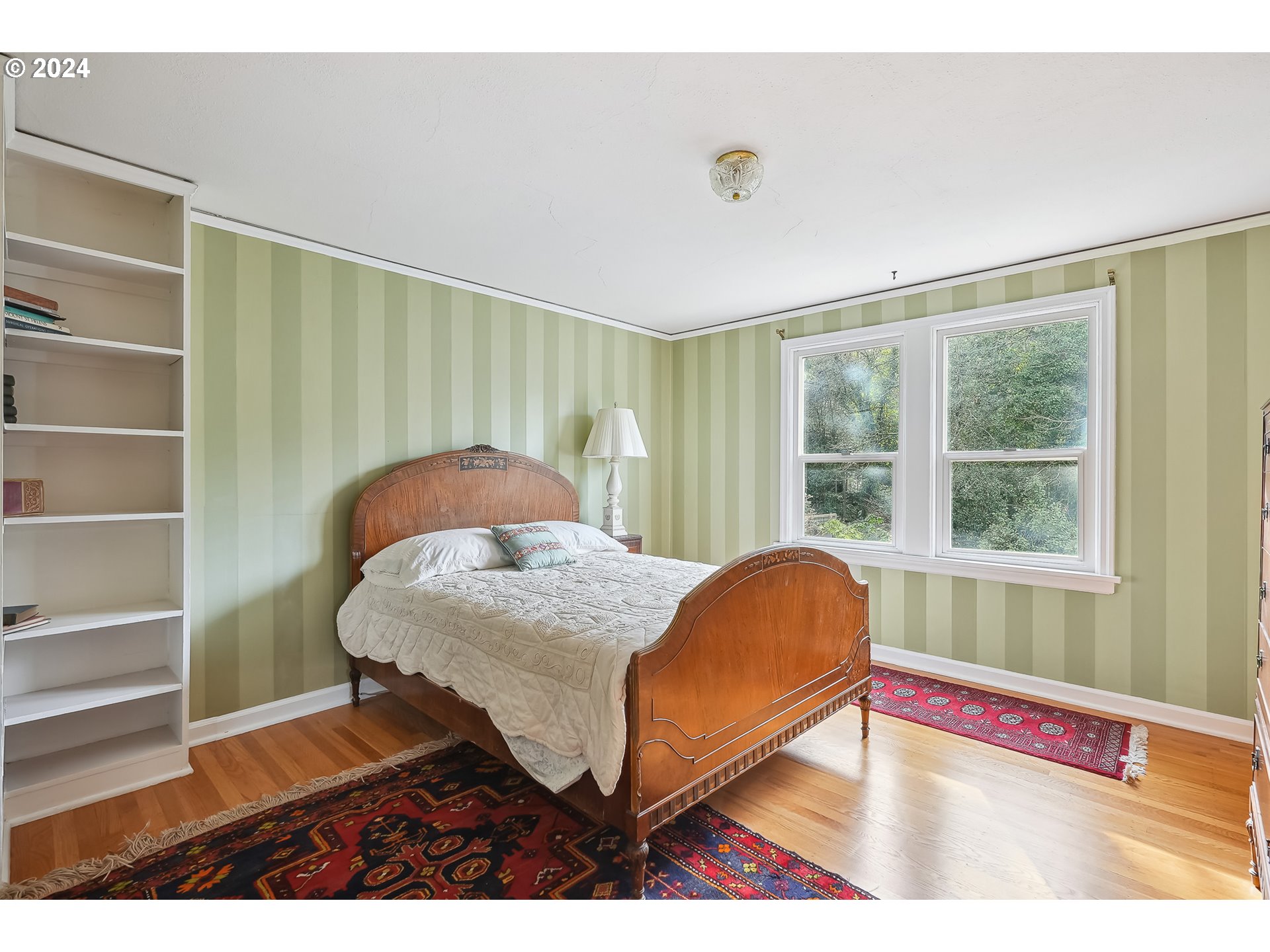 1628 Southwest College Street Portland, OR 97201 - Photo 15 of 25 a living room with a bed and a window