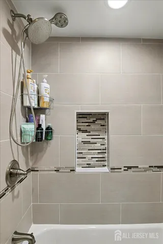 a room with gym equipment and a flat screen tv