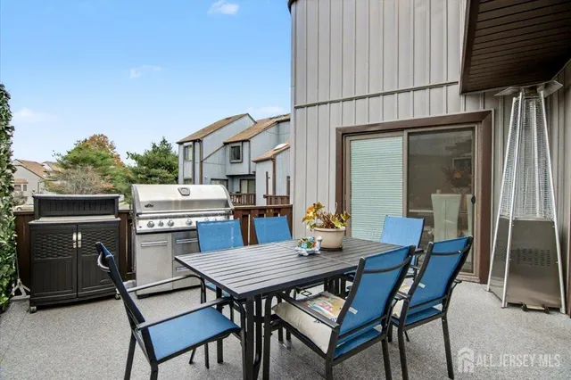 a outdoor living space with furniture and a potted plant