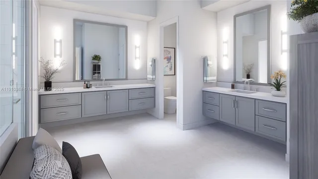 a spacious bathroom with a double vanity sink mirror and double