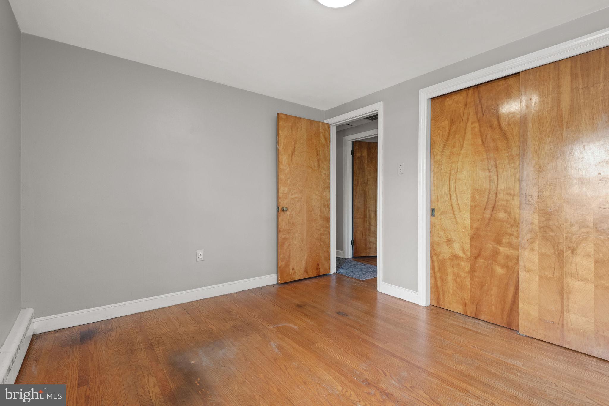 748 Clearmount Road York, PA 17403 - Photo 20 of 28 a view of an empty room with wooden floor and a window