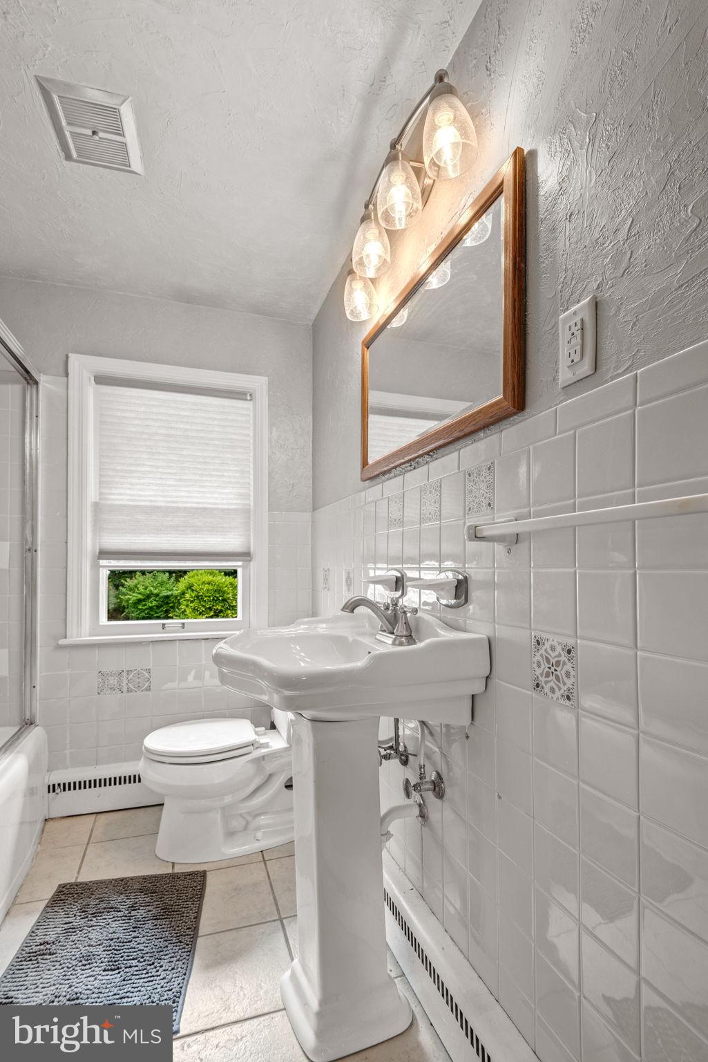 748 Clearmount Road York, PA 17403 - Photo 23 of 28 a bathroom with a sink a toilet and a mirror