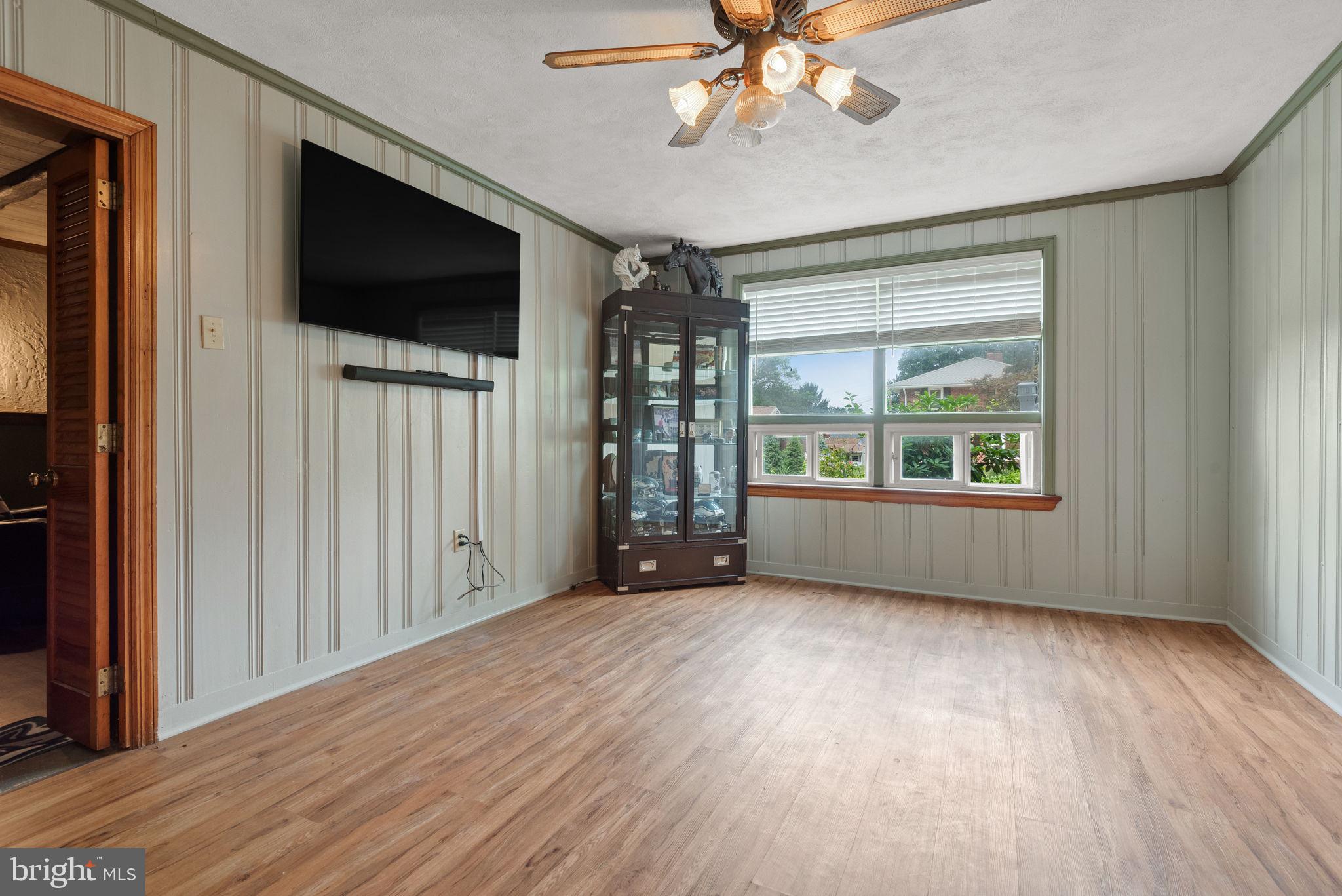 748 Clearmount Road York, PA 17403 - Photo 24 of 28 a view of an empty room with a window and wooden floor