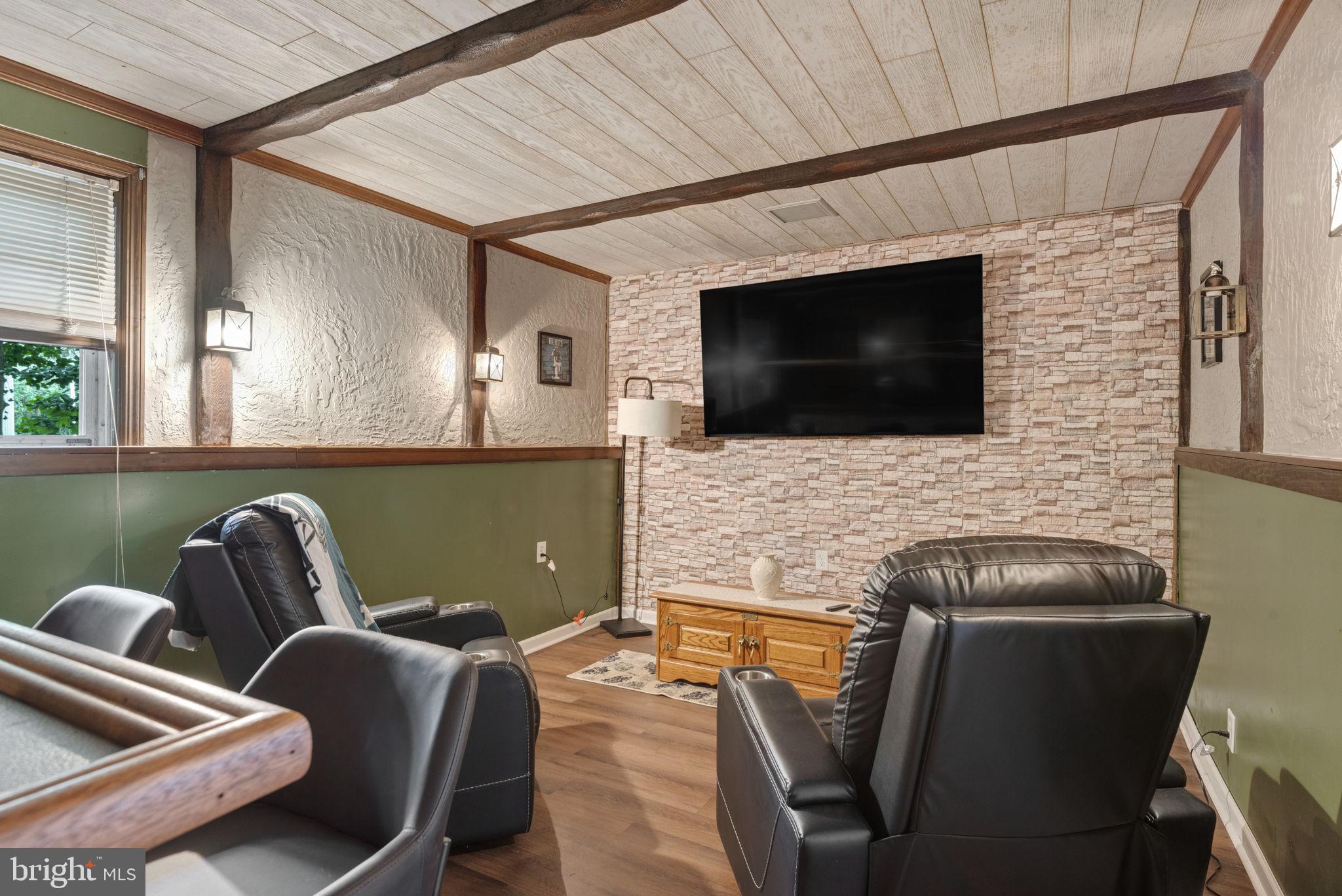 748 Clearmount Road York, PA 17403 - Photo 26 of 28 a living room with furniture and a flat screen tv