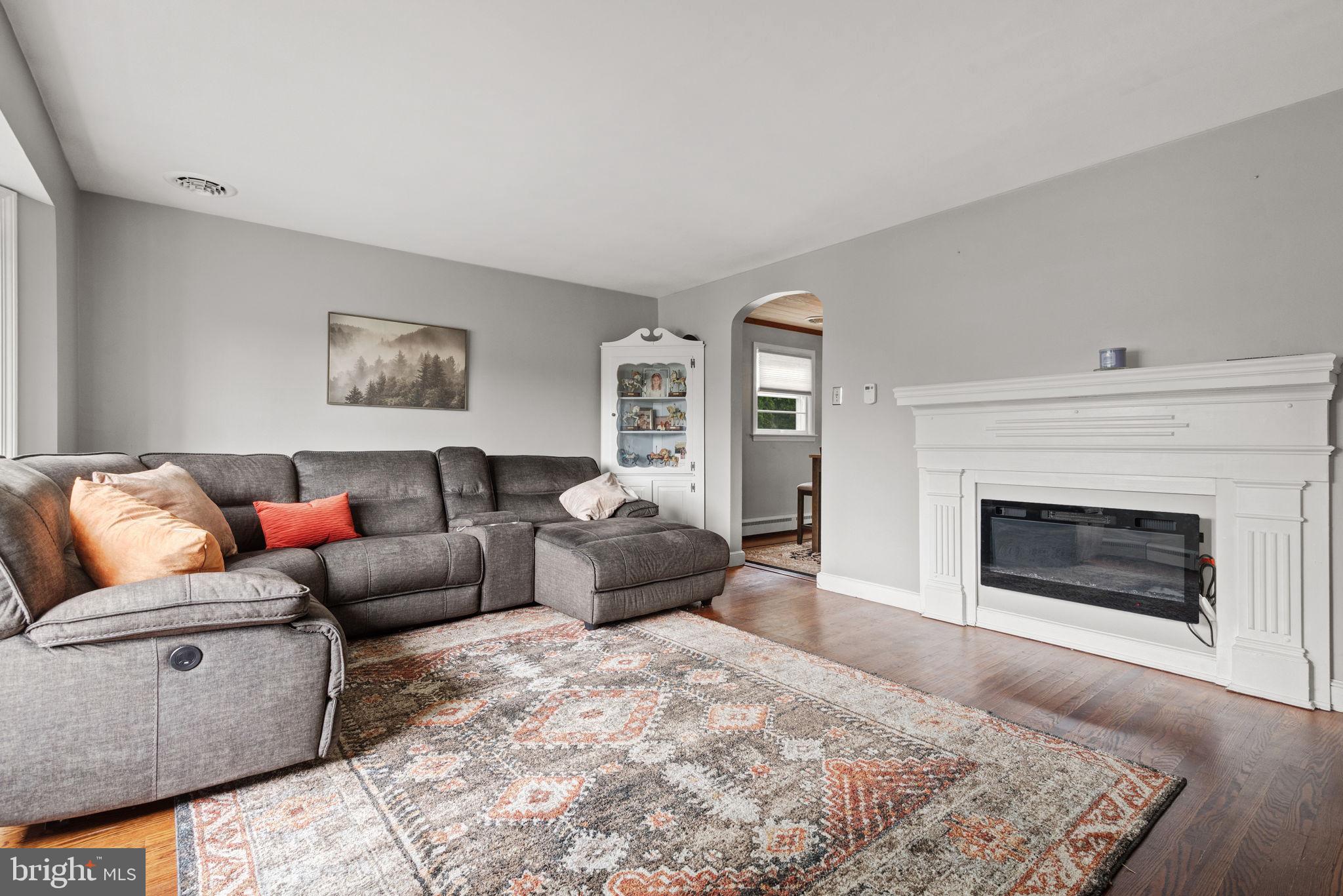 748 Clearmount Road York, PA 17403 - Photo 4 of 28 a living room with furniture and a fireplace