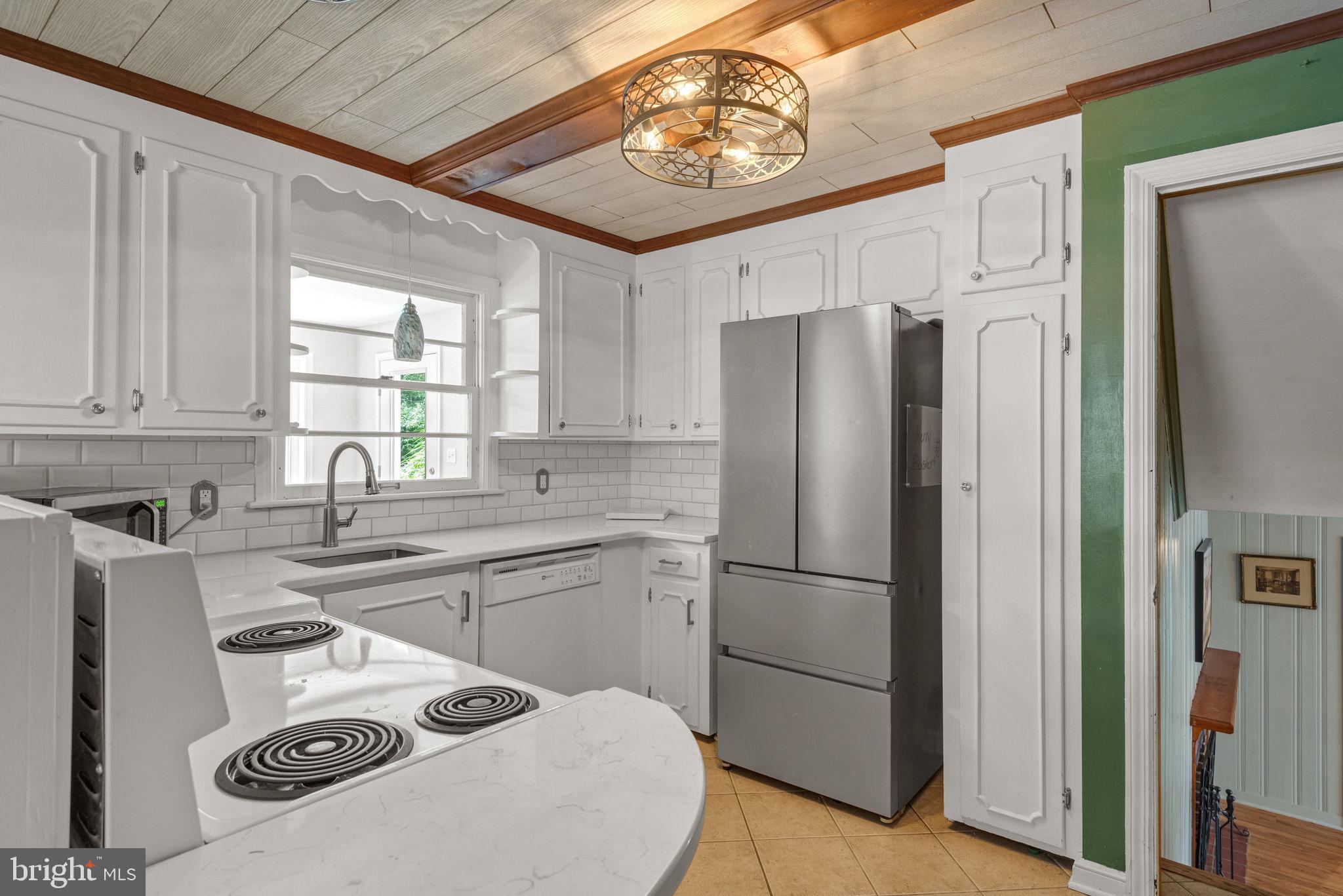 748 Clearmount Road York, PA 17403 - Photo 9 of 28 a kitchen with appliances a refrigerator and a sink