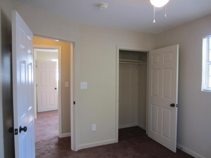 294 Elder Road Memphis, TN 38109 - Photo 6 of 8 a view of a livingroom with a hallway