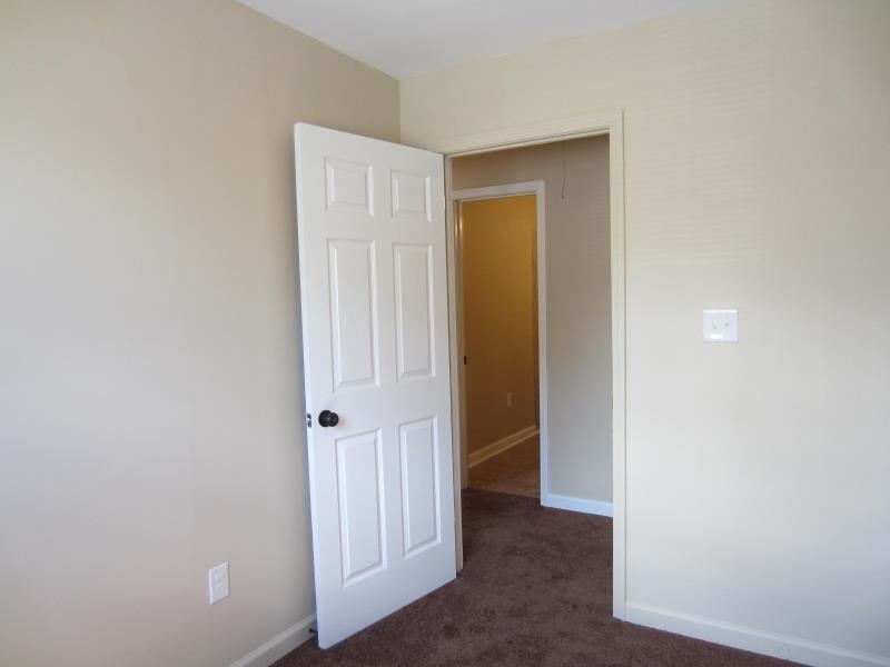 294 Elder Road Memphis, TN 38109 - Photo 8 of 8 an empty room with windows