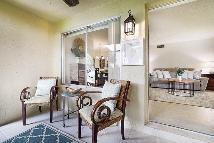306 Pine Ridge Circle, Unit D1 Greenacres, FL 33463 - Photo 11 of 26 a view of a livingroom with furniture and windows