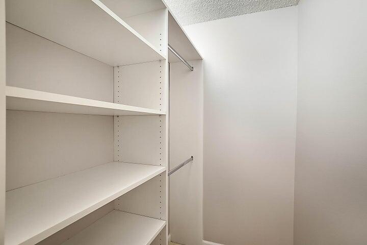 306 Pine Ridge Circle, Unit D1 Greenacres, FL 33463 - Photo 21 of 26 a view of an empty walk in closet