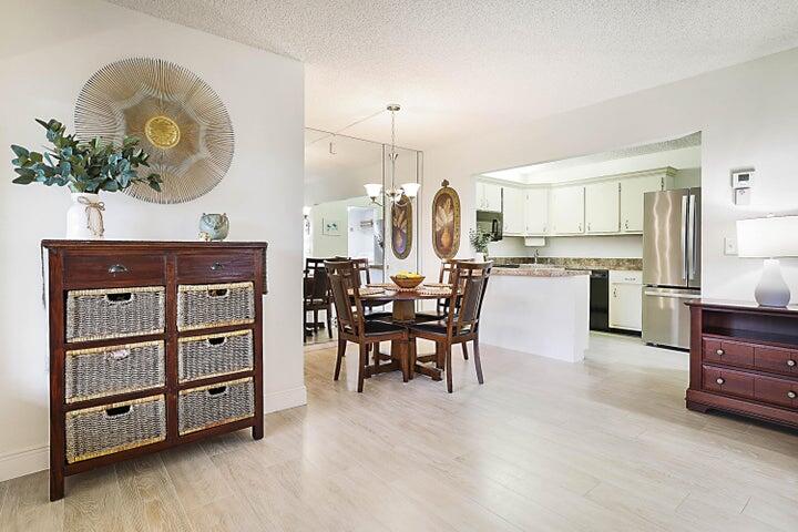 306 Pine Ridge Circle, Unit D1 Greenacres, FL 33463 - Photo 4 of 26 a view of kitchen with cabinets and outdoor seating