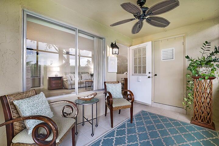306 Pine Ridge Circle, Unit D1 Greenacres, FL 33463 - Photo 10 of 26 a living room with furniture and a large window