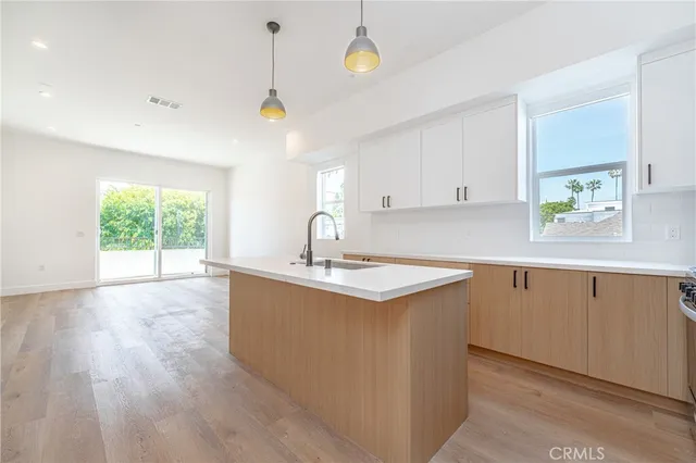 an empty room with wooden floor