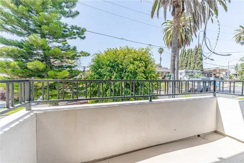 a bathroom with a granite countertop sink a mirror and a bathtub