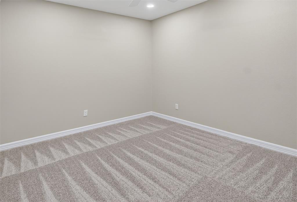 2122 Clear Lake Road Weatherford, TX 76087 - Photo 34 of 40 Third of three bedrooms with can lighting and ceiling fan.