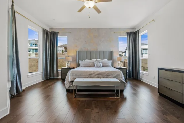 a bedroom with a bed and a chandelier