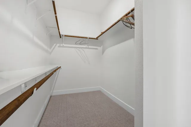 a view of an empty walk in closet