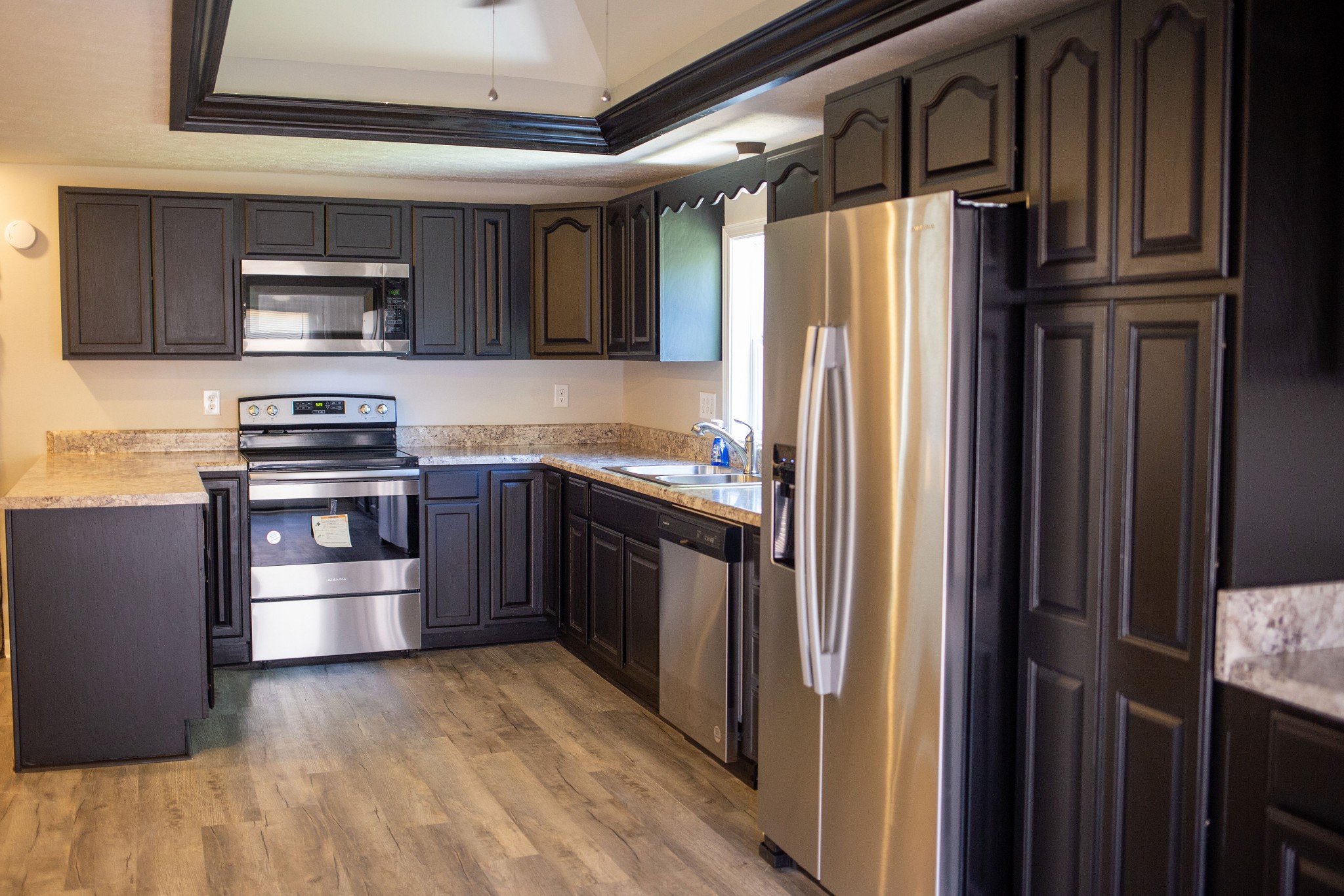 125 Corinth Road Portland, TN 37148 - Photo 15 of 30 a kitchen with stainless steel appliances granite countertop a refrigerator and a stove top oven