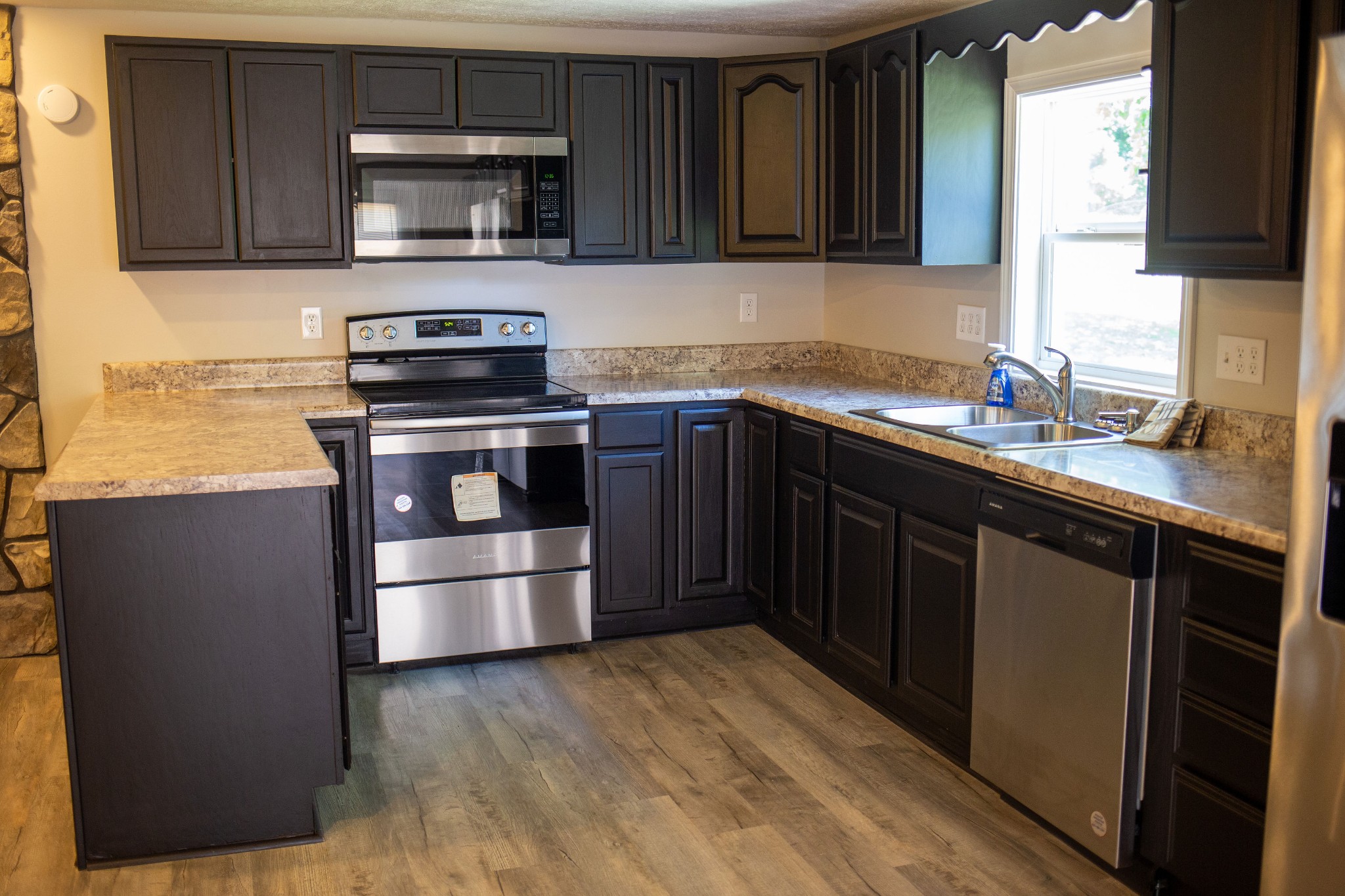 125 Corinth Road Portland, TN 37148 - Photo 16 of 30 a kitchen with a sink and steel appliances