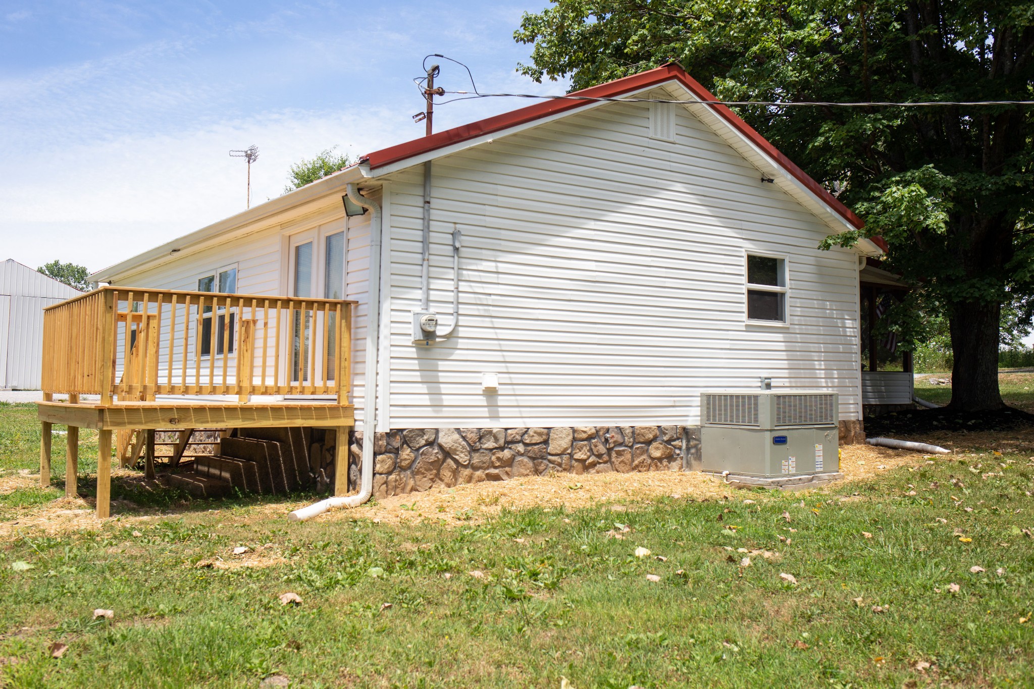 125 Corinth Road Portland, TN 37148 - Photo 7 of 30 a view of a house with wooden deck