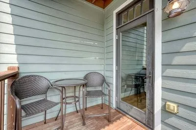 a front view of a house with outdoor seating