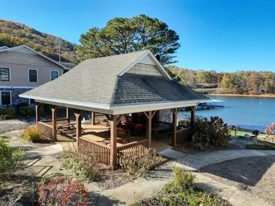 a view of a roof deck with lake view and mountain view