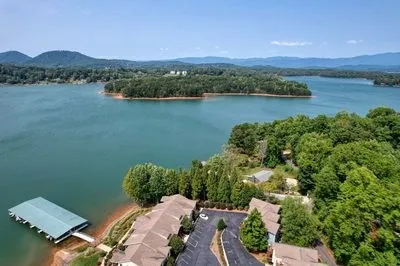 an aerial view of a residential houses and lake view