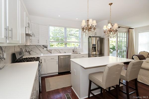 4 Spring Court Huntington, NY 11743 - Photo 11 of 38 a view of a dining room with furniture window and wooden floor