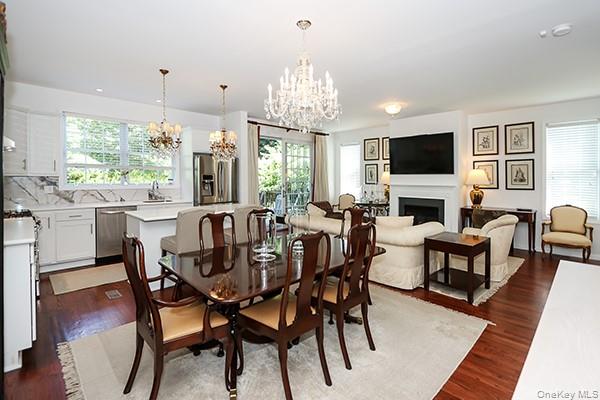 4 Spring Court Huntington, NY 11743 - Photo 38 of 38 a view of a dining room with furniture window and wooden floor